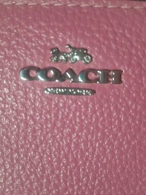 Coach Pink Phone Case with Silver 'LOVE' Logo Accent
